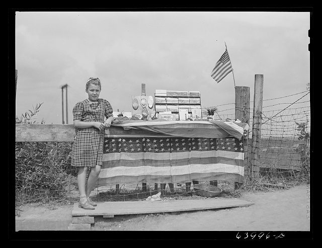 Girl who sells pieces of ore and iron range souvenirs to tourists. Hibbing, Minnesota.